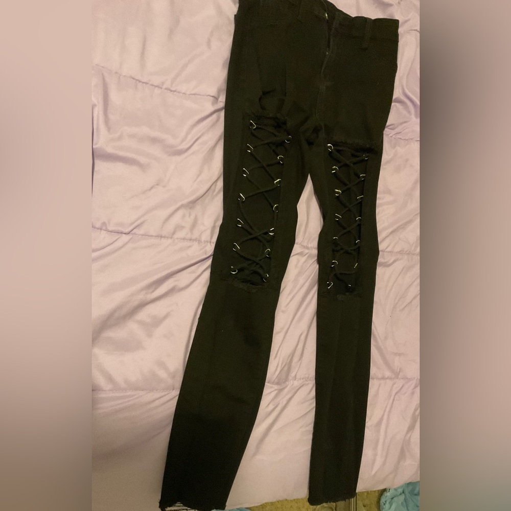 Black jeans with string tie rips